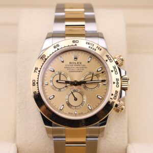 Two-tone chronograph watch on wrist with champagne dial