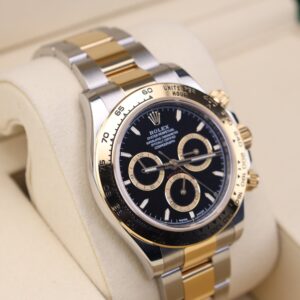 Two-tone chronograph watch on wrist