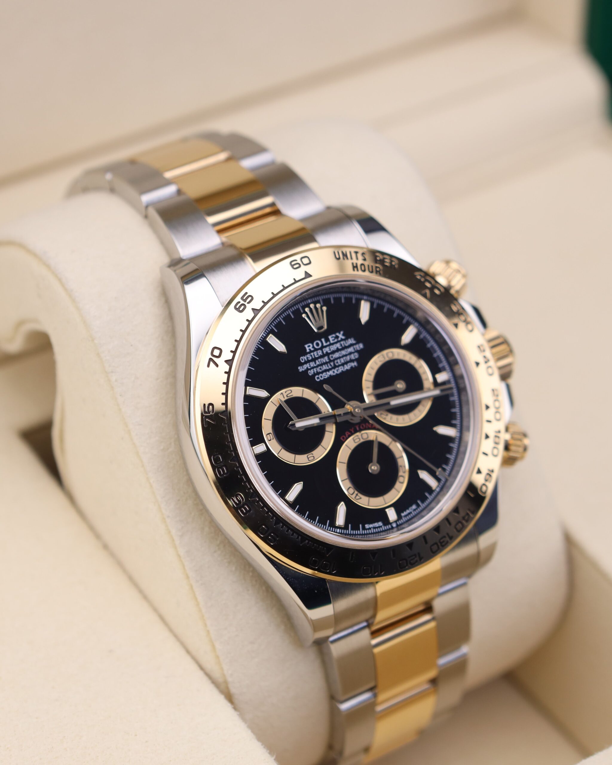 Two-tone chronograph watch on wrist