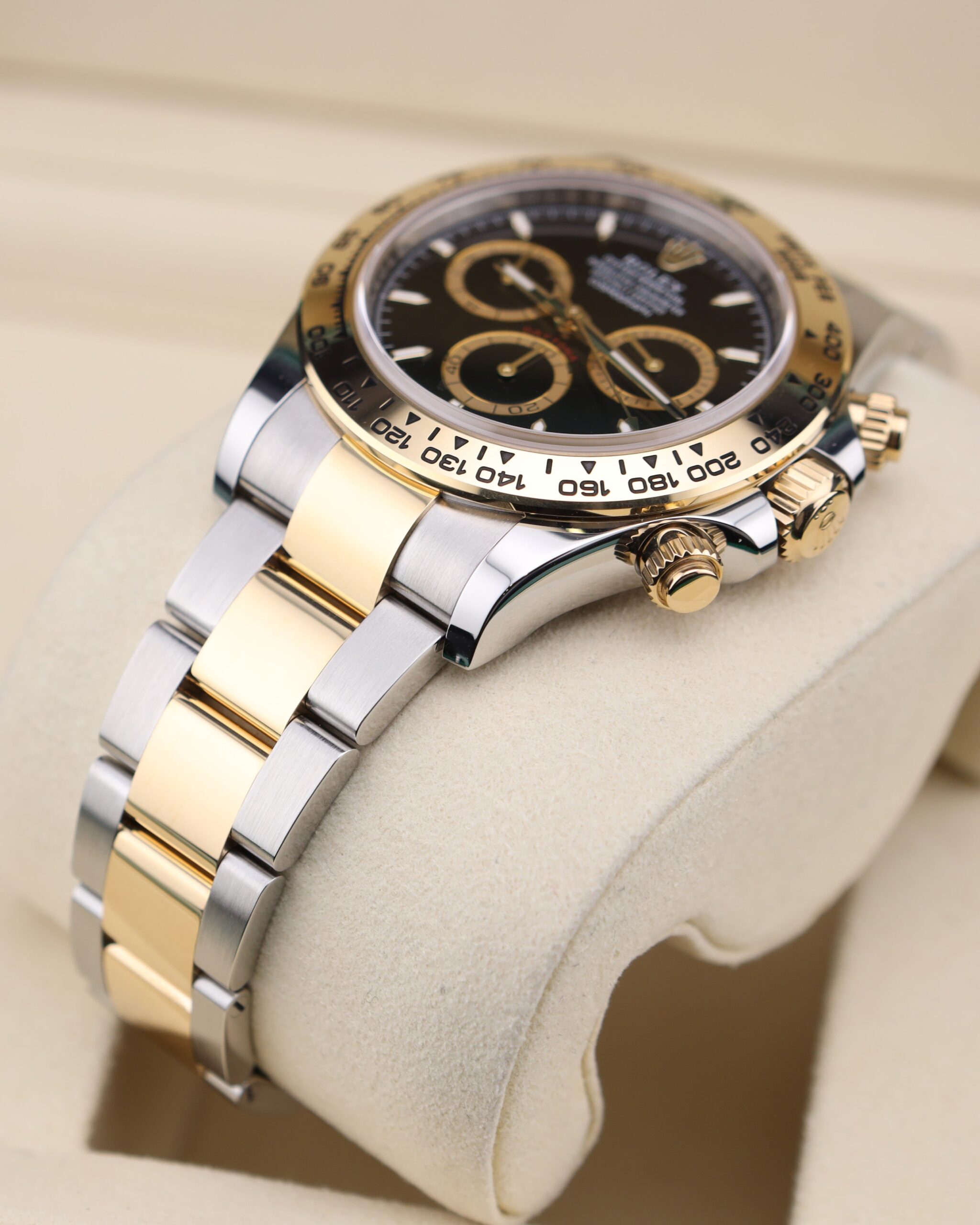 Close-up of black dial two-tone chronograph watch