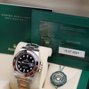 Pre-owned two-tone automatic watch with black and brown bezel