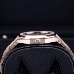 Luxury rose gold watch on wrist with blue dial