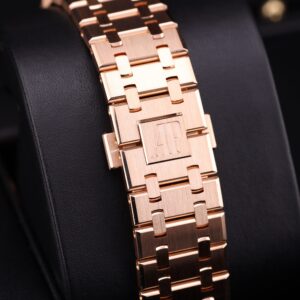 Side profile of rose gold watch with blue face