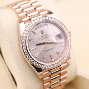 Pink dial ladies watch with diamond bezel