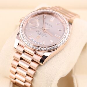 Luxury ladies watch with pink dial and diamond bezel close-up