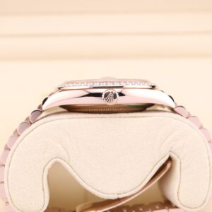 Side view of ladies watch with pink face and diamond accents