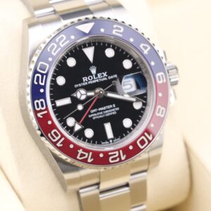 Sporty stainless steel watch with red and blue bezel