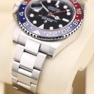 Pre-owned stainless steel watch with bold bezel colors