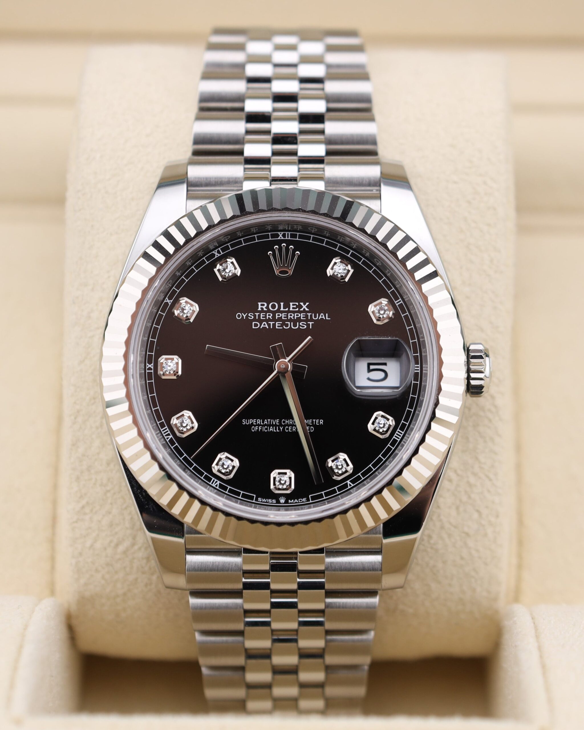 Luxury watch with black diamond dial and jubilee bracelet