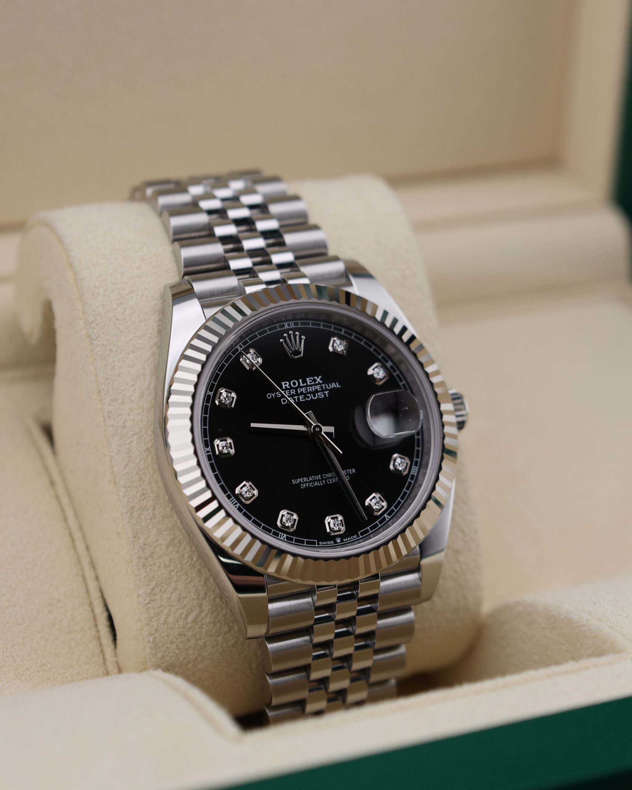 Black dial luxury watch with diamond markers