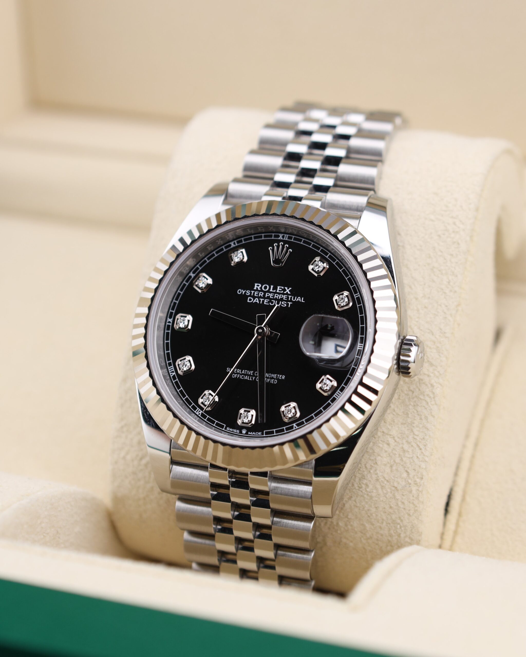 Black dial watch with diamond hour markers