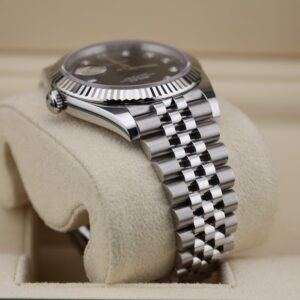 Luxury watch with black diamond dial and jubilee bracelet