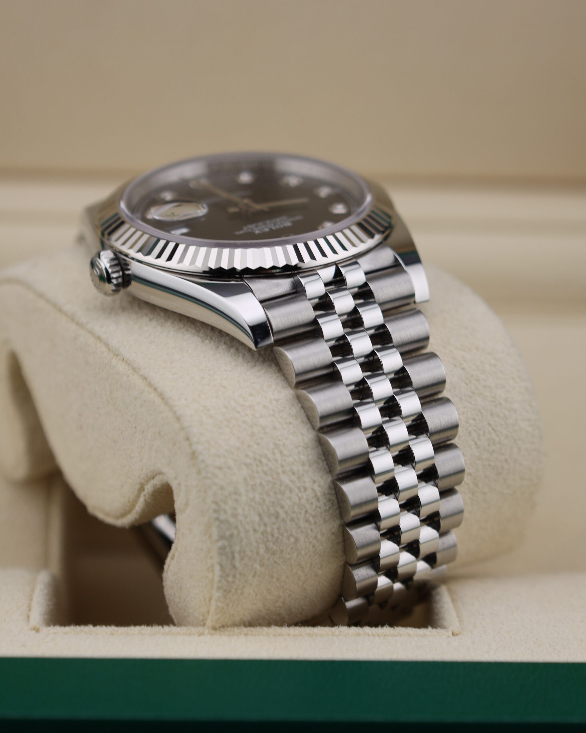 Luxury watch with black diamond dial and jubilee bracelet