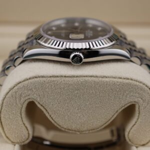 Close-up of diamond accented black dial watch