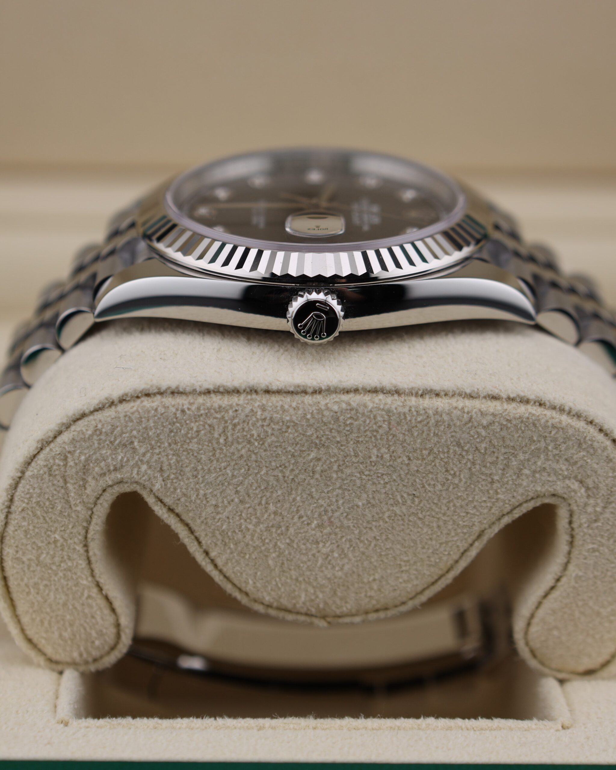 Close-up of diamond accented black dial watch