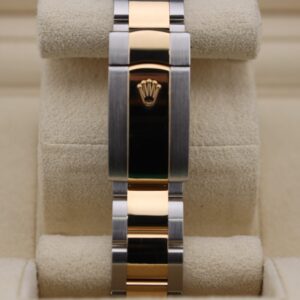 Side profile of two-tone luxury wristwatch