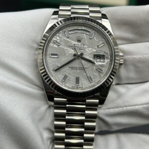 Luxury watch crown and meteorite dial detail