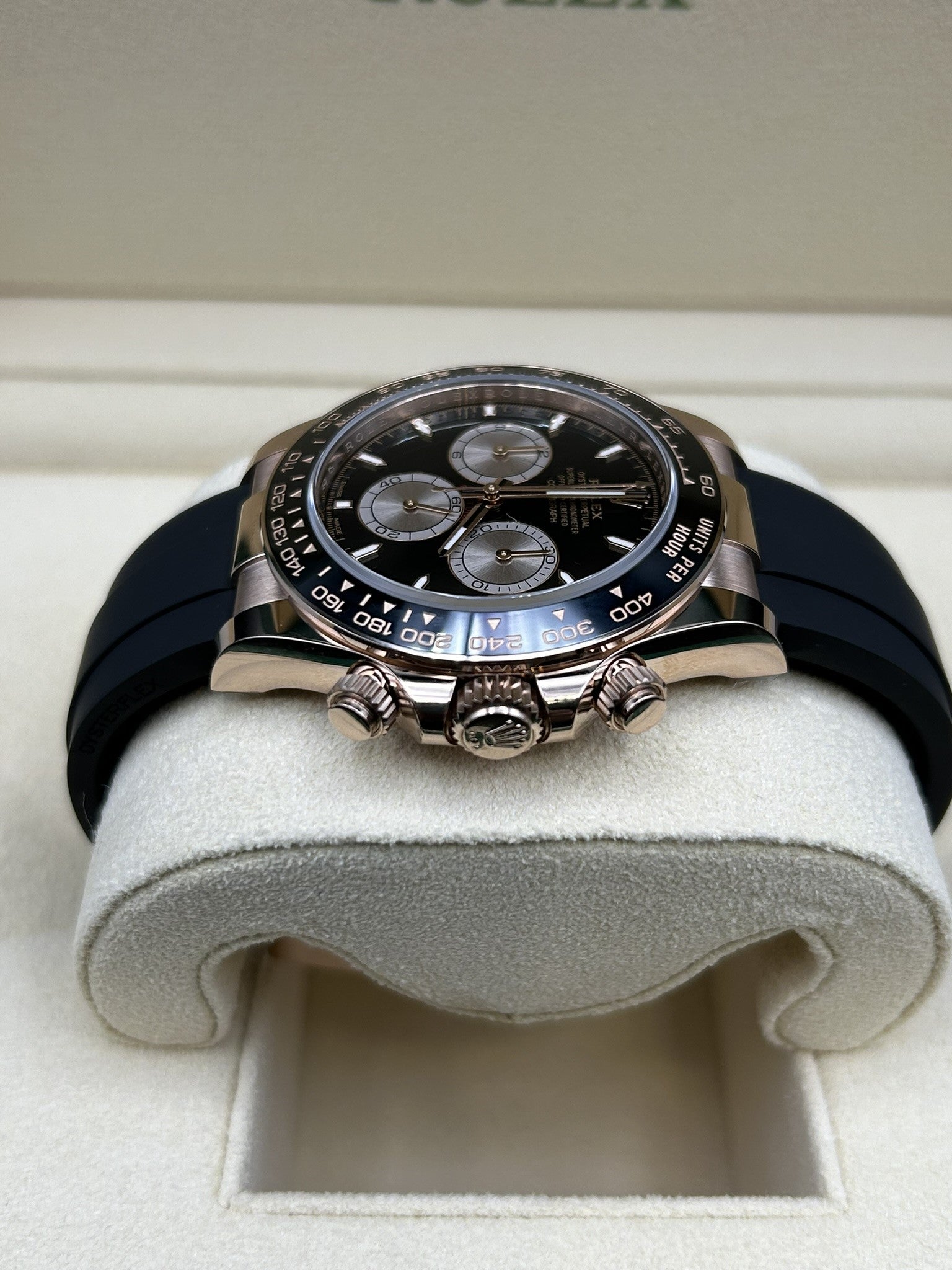 Rose gold watch with black chronograph face