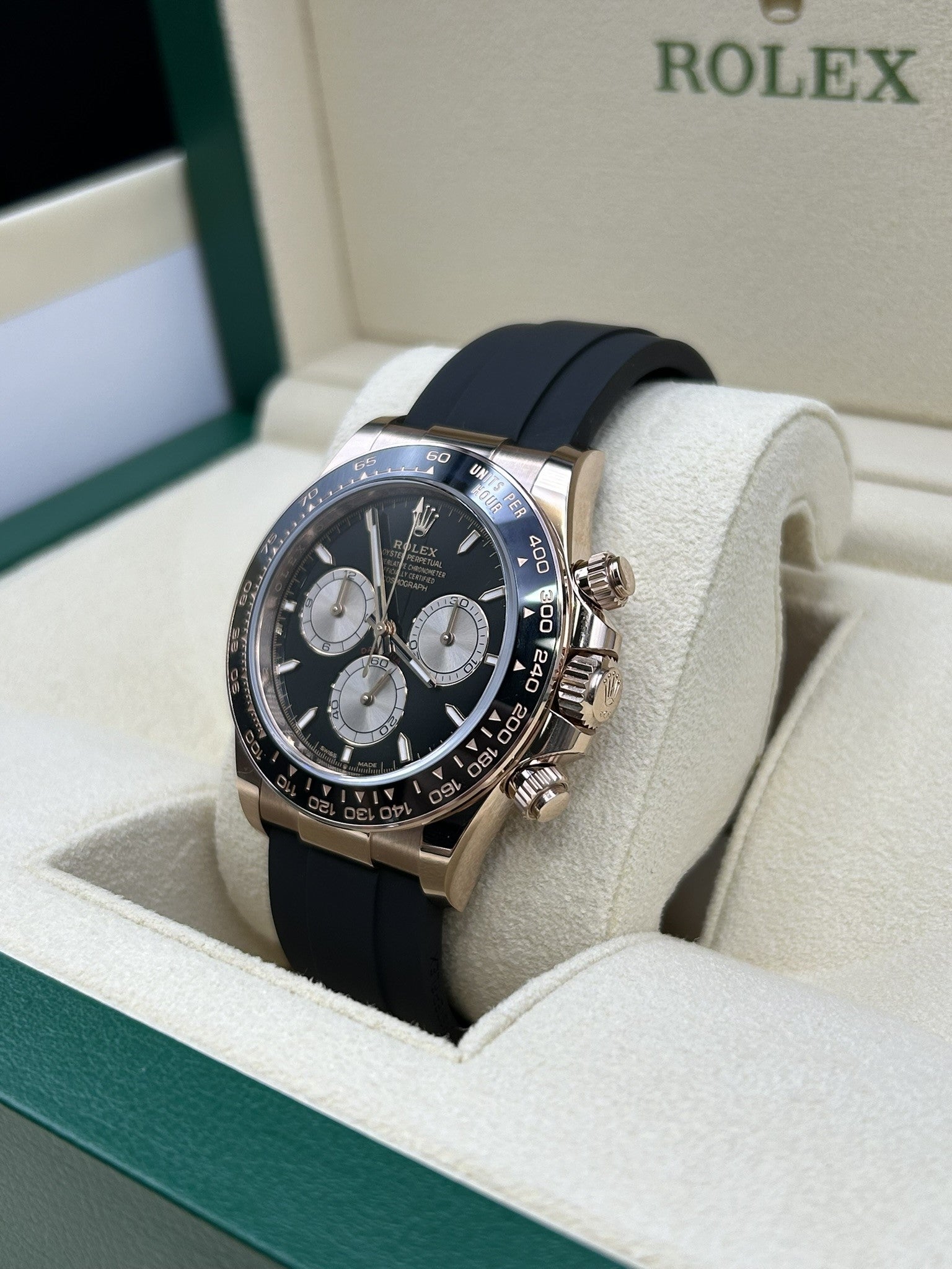 Rose gold watch with black chronograph dial