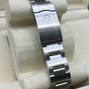 Close-up of green dial luxury watch