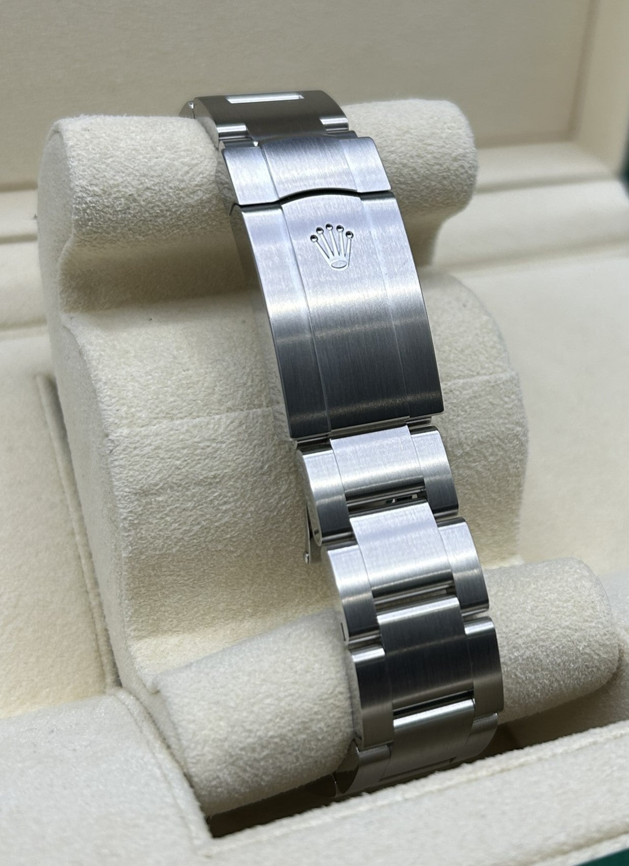 Close-up of green dial luxury watch