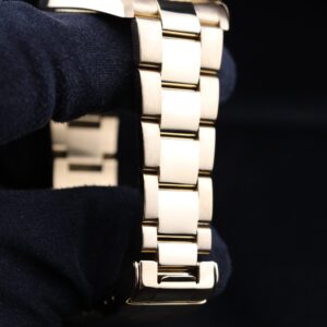 Side profile of yellow gold diver watch