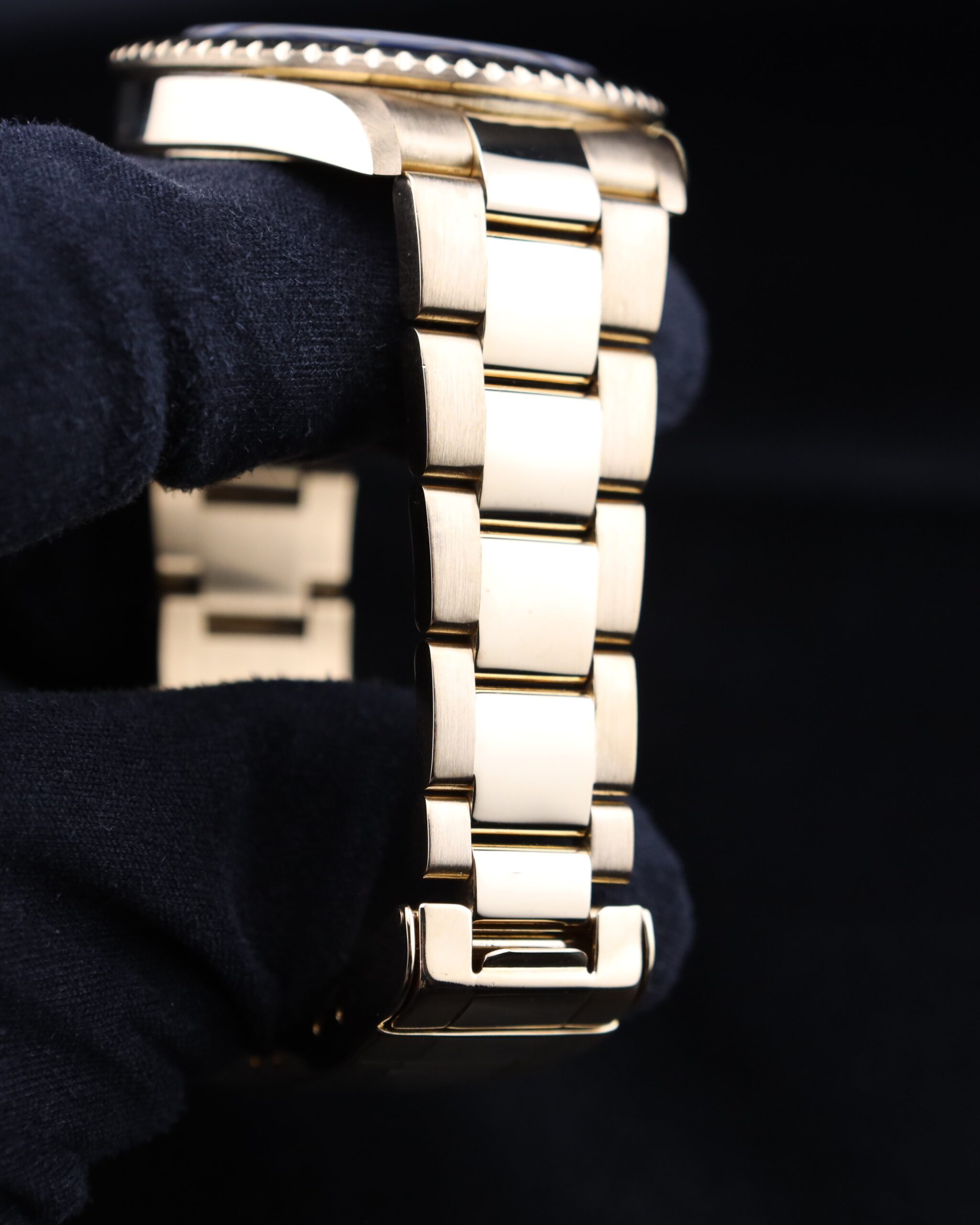 Side profile of yellow gold diver watch