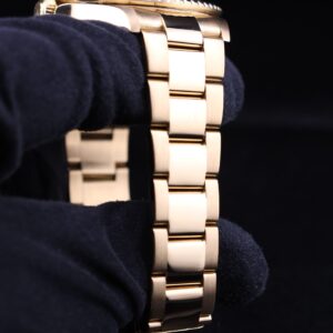 Close-up of yellow gold diver watch dial