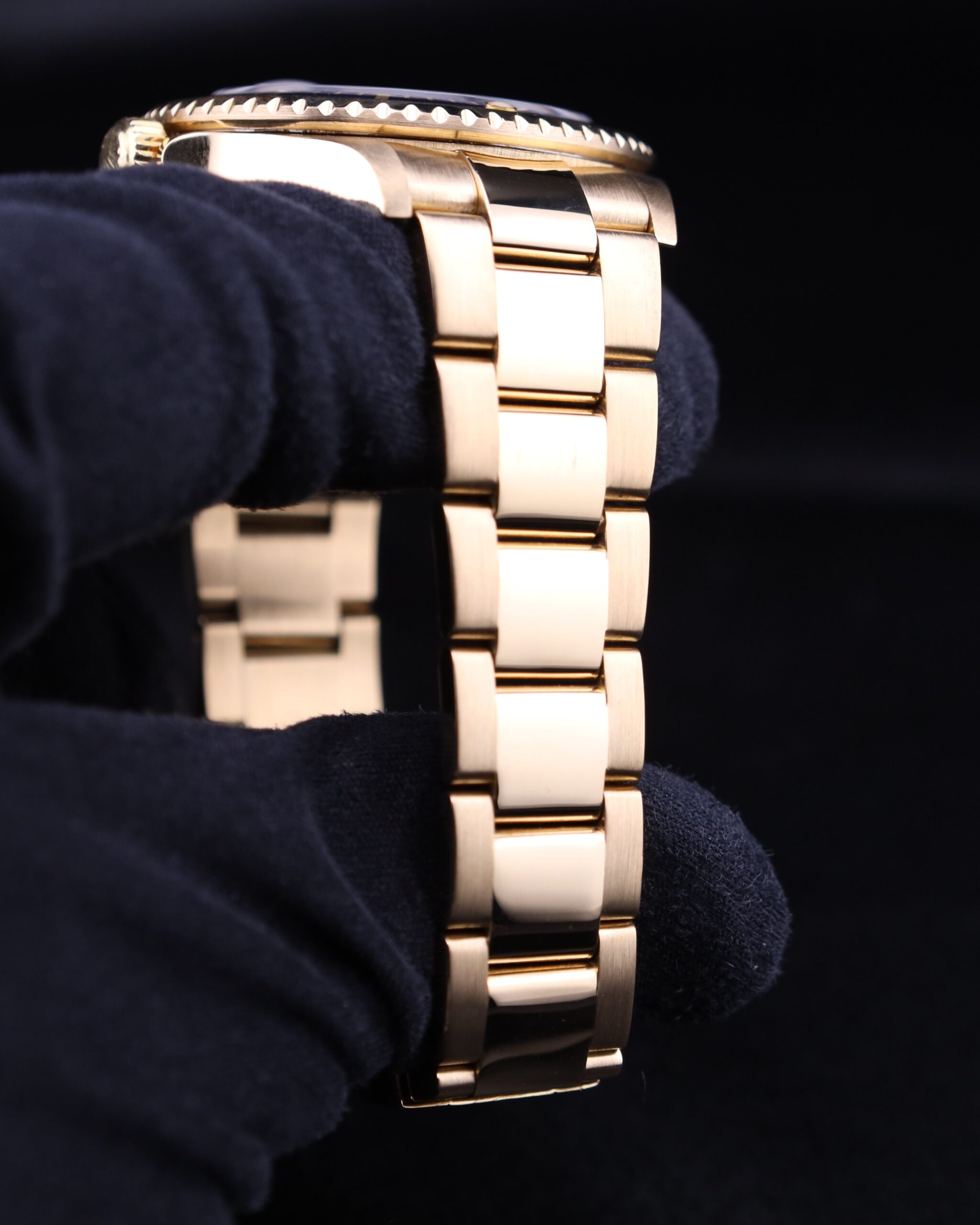 Close-up of yellow gold diver watch dial