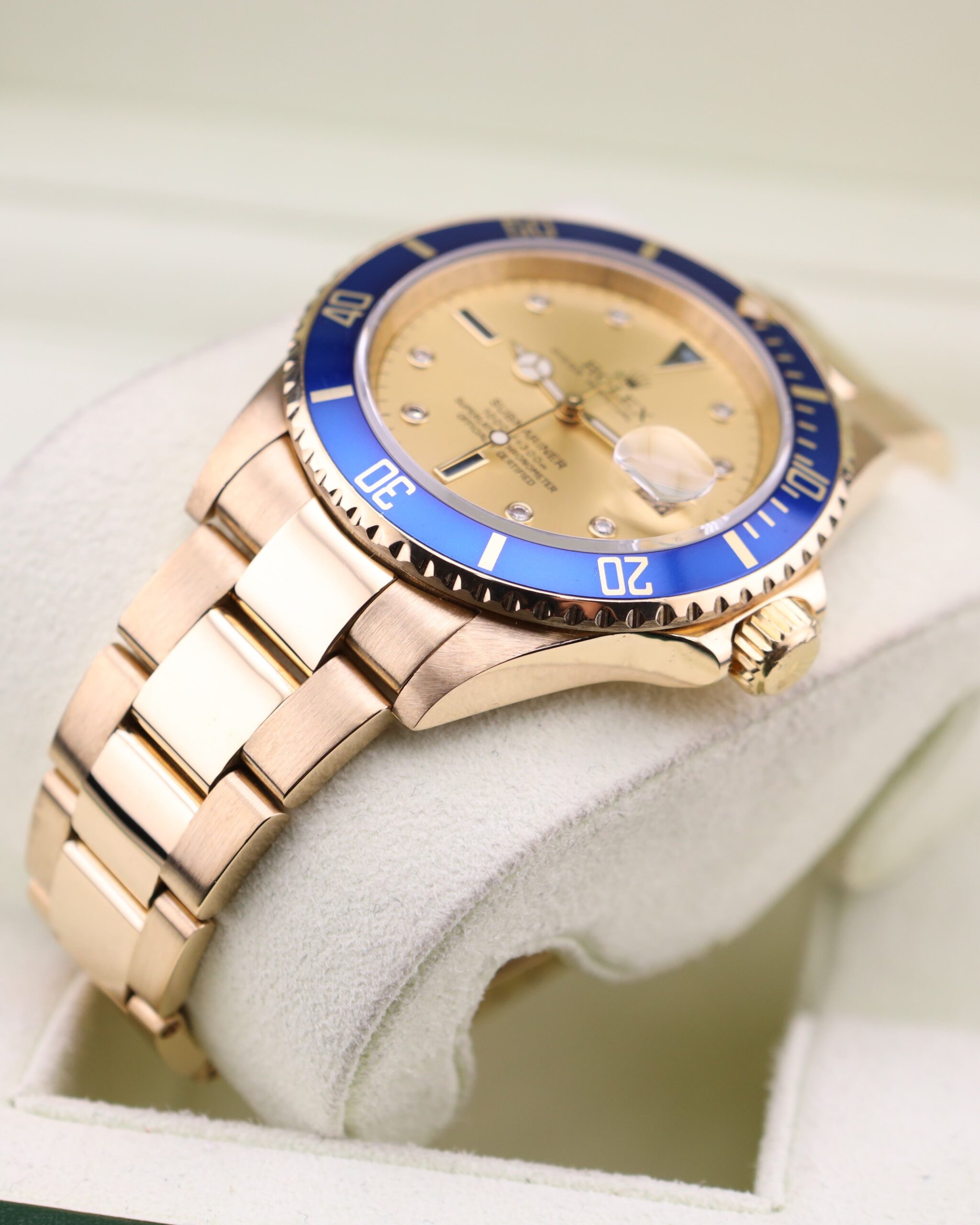Yellow gold Rolex Submariner with champagne dial