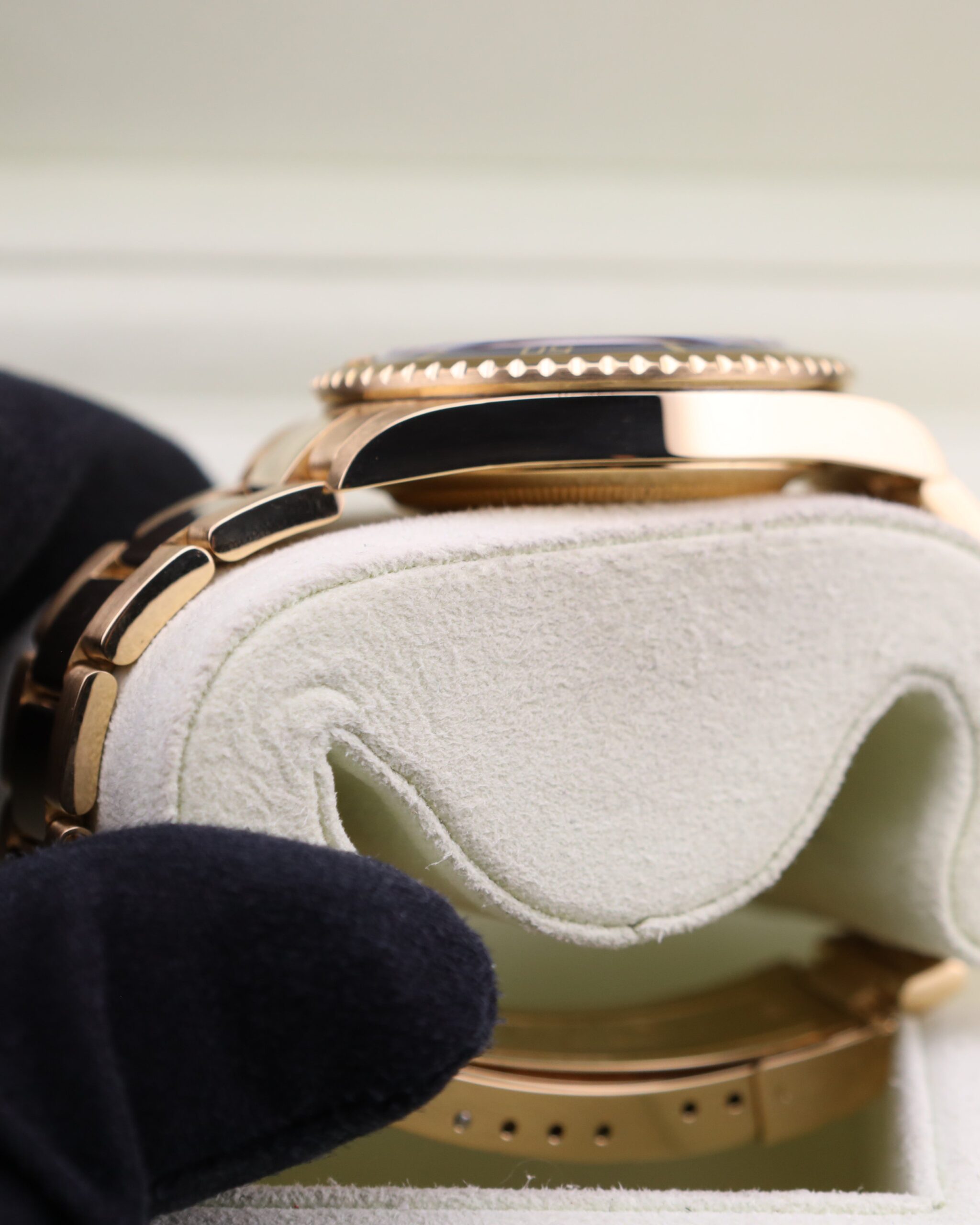 Rolex Submariner yellow gold wristwatch side view