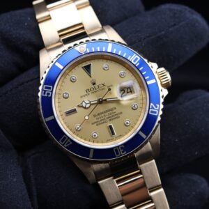 Yellow gold Rolex Submariner with champagne dial