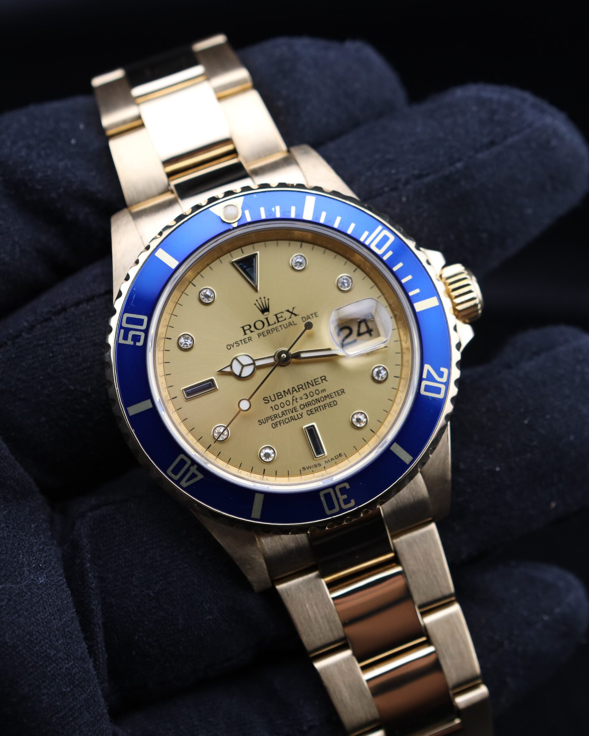 Yellow gold Rolex Submariner with champagne dial