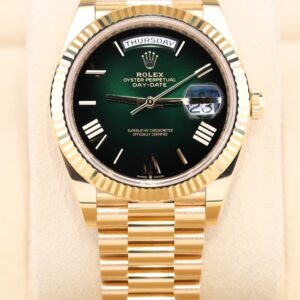 Yellow gold luxury dress watch with green dial