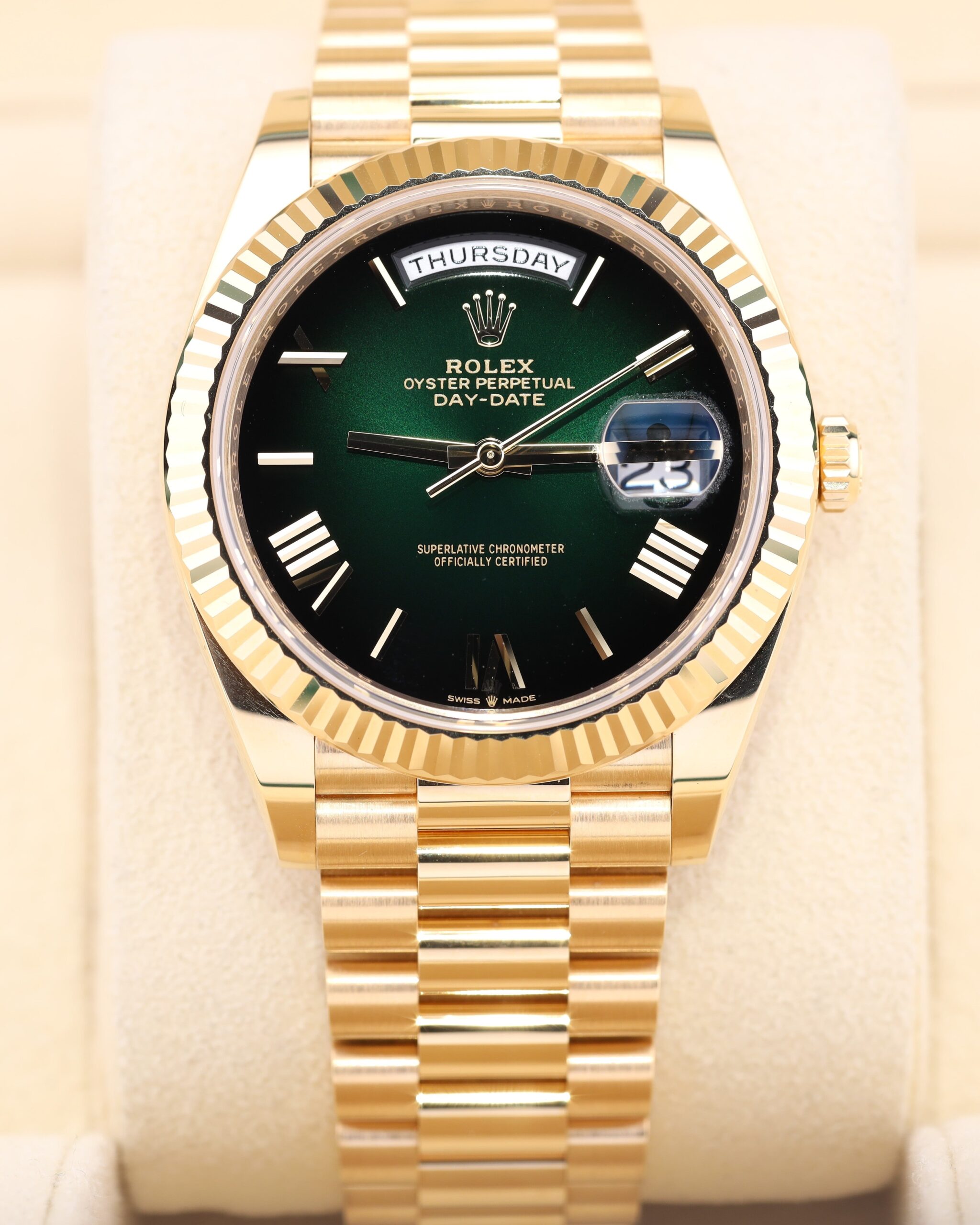 Yellow gold luxury dress watch with green dial