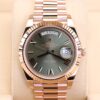 Rose gold watch with olive green dial