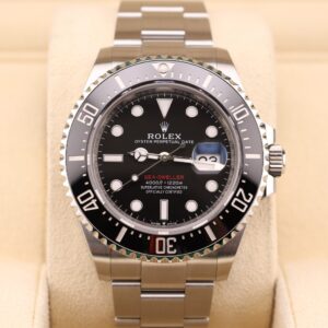 Black dial vintage diver watch with red accents