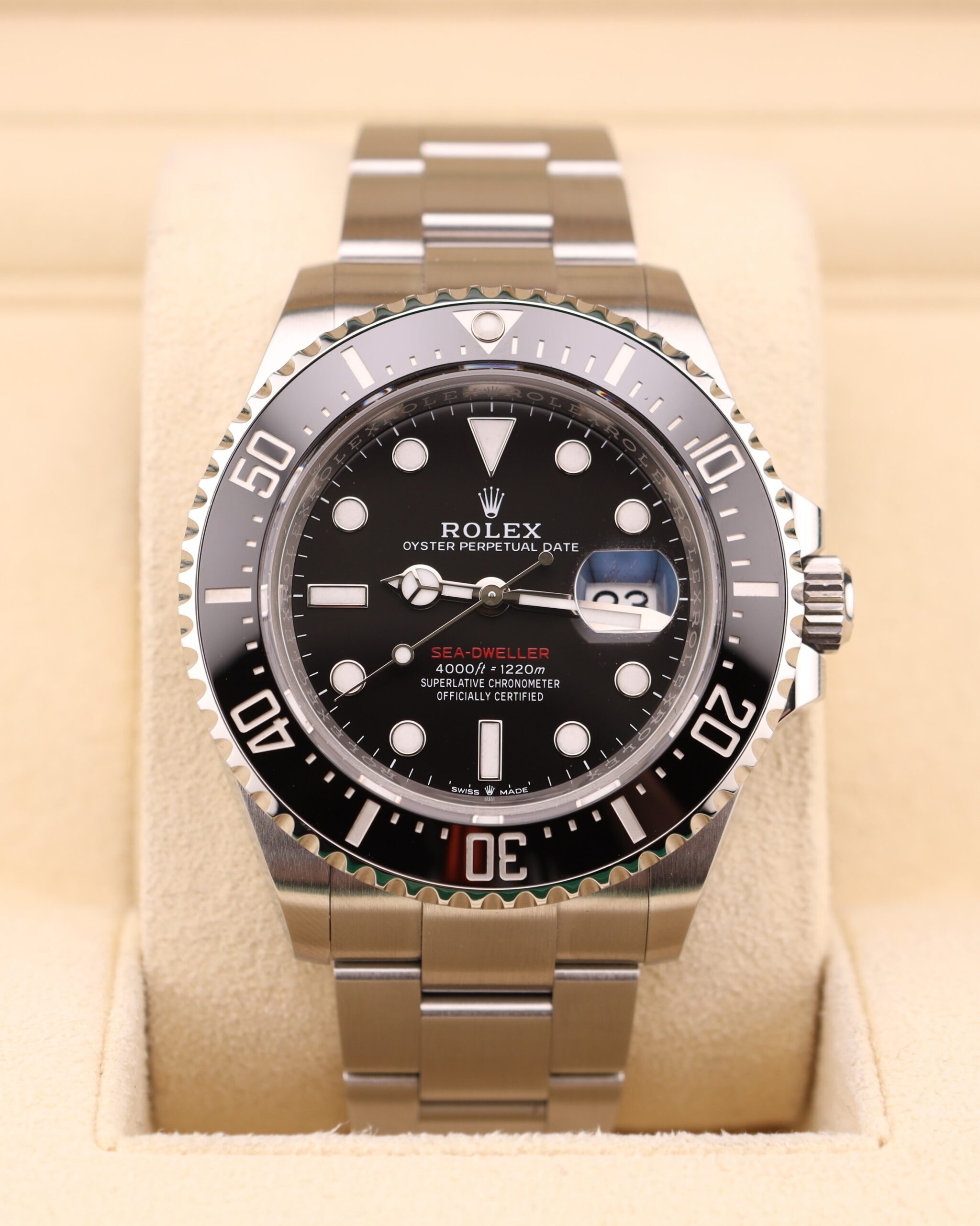 Black dial vintage diver watch with red accents