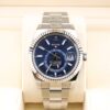 Blue dial luxury wristwatch on metal bracelet