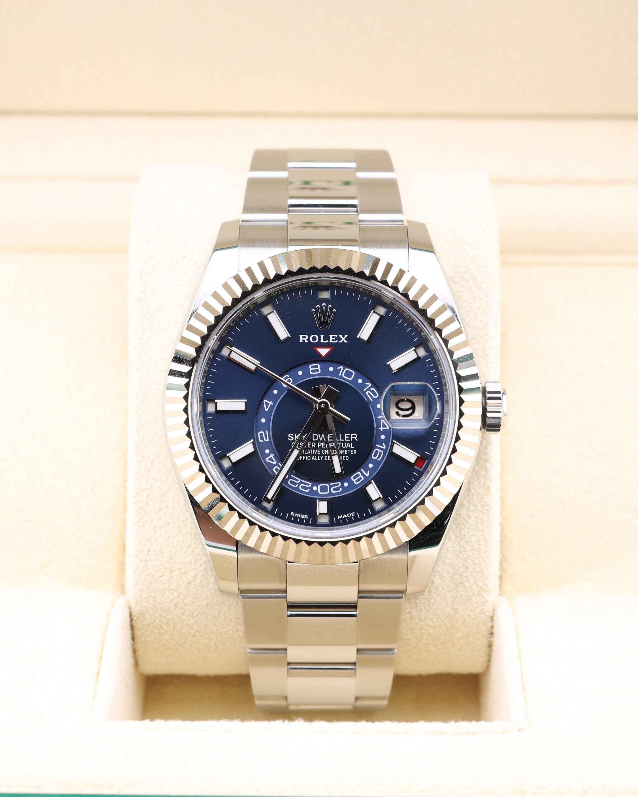 Blue dial luxury wristwatch on metal bracelet